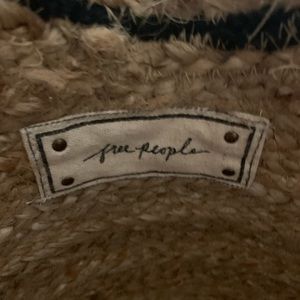 An artisan crafted woven beach tote.